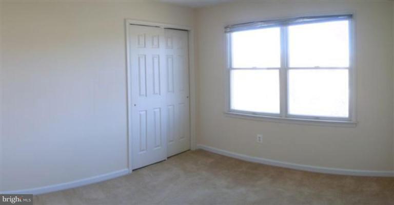 1307 Dasher Lane Reston, VA 20190 - Photo 4 of 29 an empty room with a window