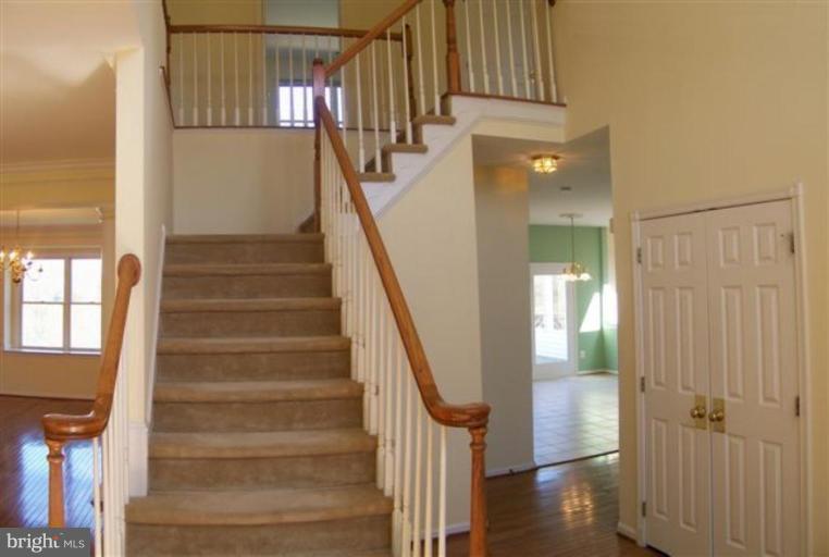 1307 Dasher Lane Reston, VA 20190 - Photo 10 of 29 a view of entryway and hall with wooden floor