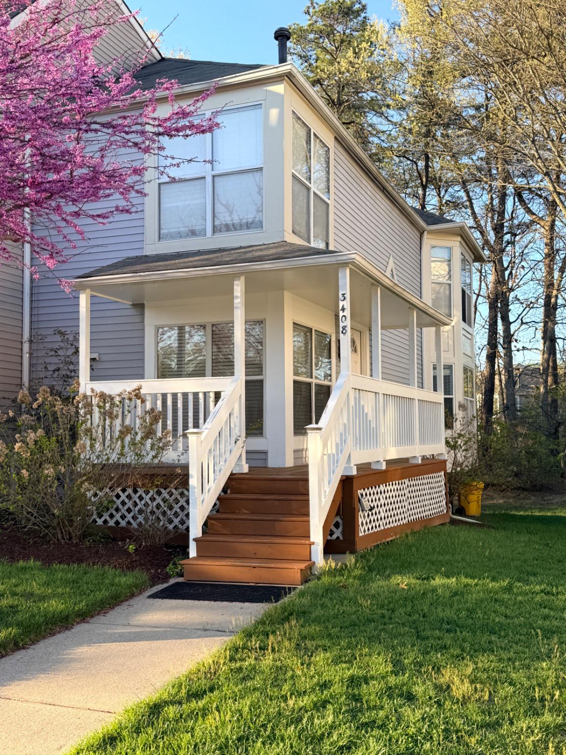 Charming home with wrap around and inviting porch.