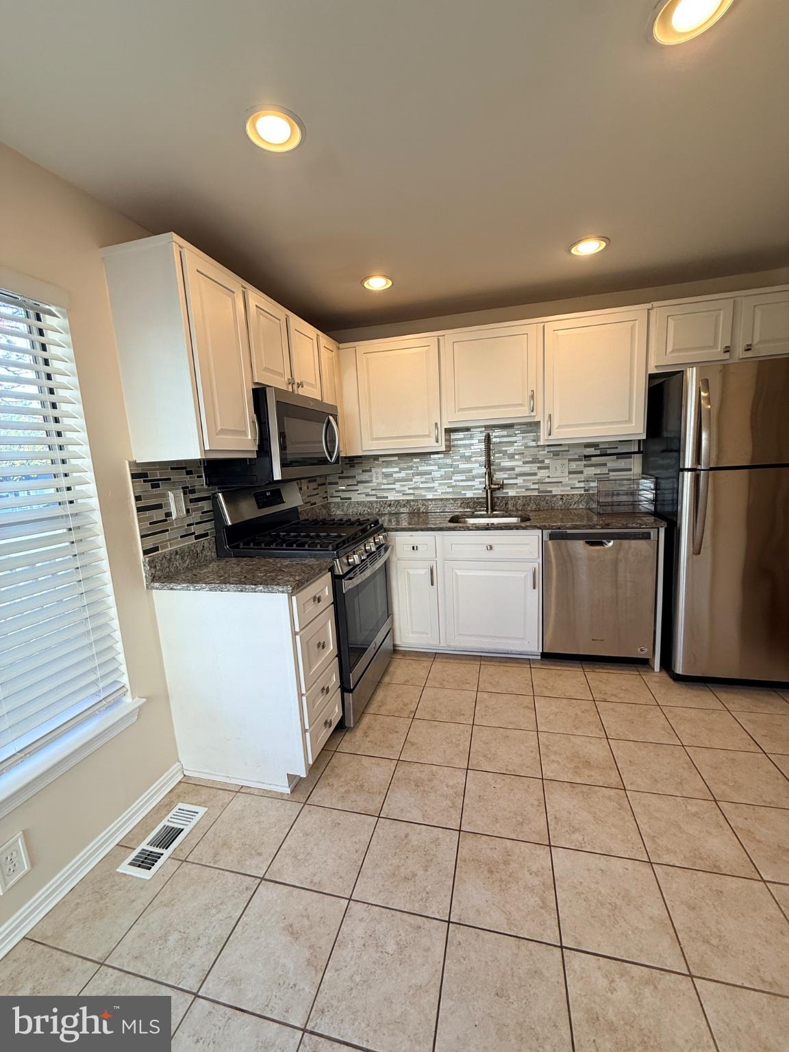 3408 Littleleaf Place Laurel, MD 20724 - Photo 2 of 5 Modern kitchen with sleek finishes.