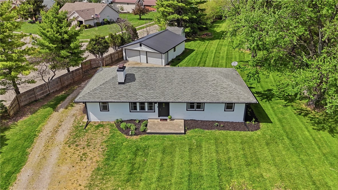 3991 Benner Road Miamisburg, OH 45342 - Photo 2 of 44 This charming home features a well-maintained exterior and a separate garage, offering ample space and convenience.