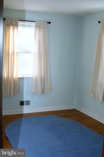 5502 Park Road Brooklyn, MD 21225 - Photo 4 of 8 2nd bedroom w/hardwood floors