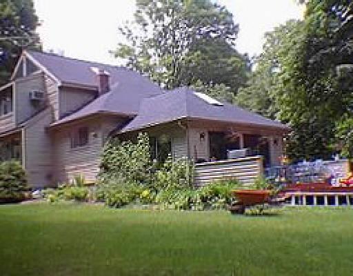 326 North Salem Road Ridgefield, CT 06877 - Photo 1 of 1 a front view of a house with a garden and porch