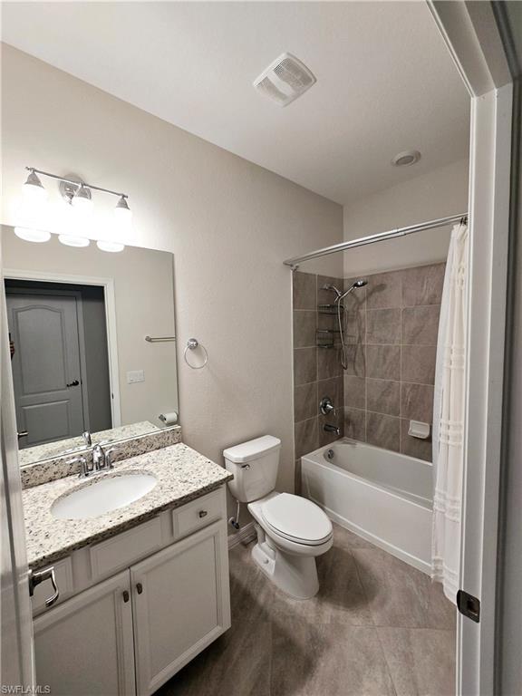 Undisclosed Address Naples, FL 34120 - Photo 13 of 21 a bathroom with a granite countertop sink a toilet and shower