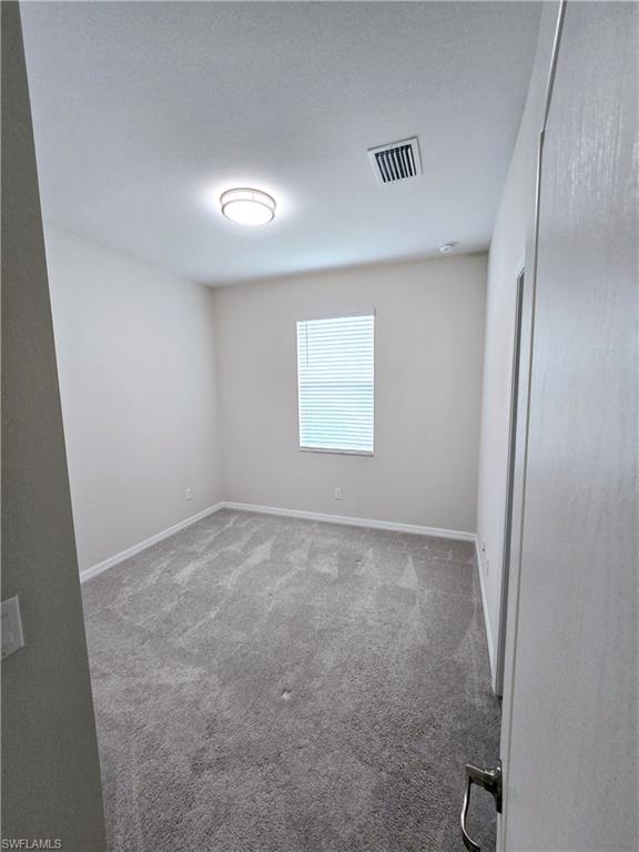 Undisclosed Address Naples, FL 34120 - Photo 15 of 21 an empty room with a window