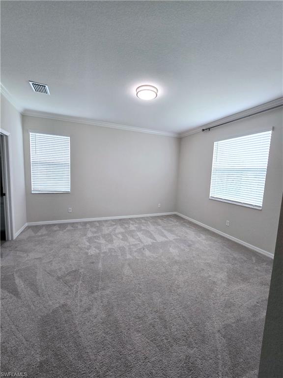 Undisclosed Address Naples, FL 34120 - Photo 17 of 21 an empty room with a window