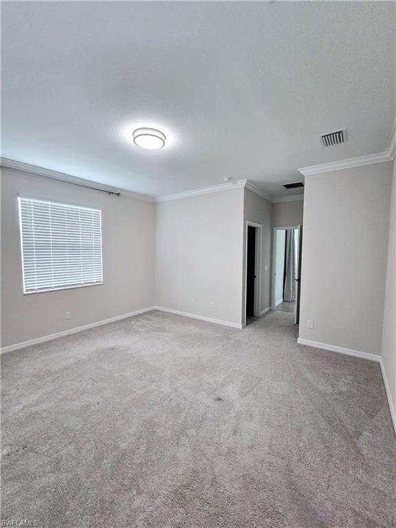 Undisclosed Address Naples, FL 34120 - Photo 18 of 21 an empty room with a empty space and windows