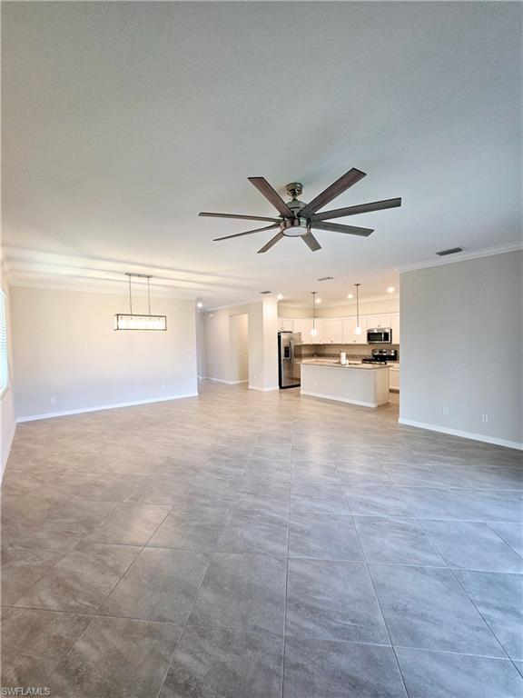 Undisclosed Address Naples, FL 34120 - Photo 19 of 21 a view of a kitchen with a sink and a stove