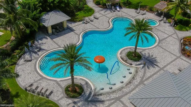 an aerial view of garden space with swimming pool and outdoor seating