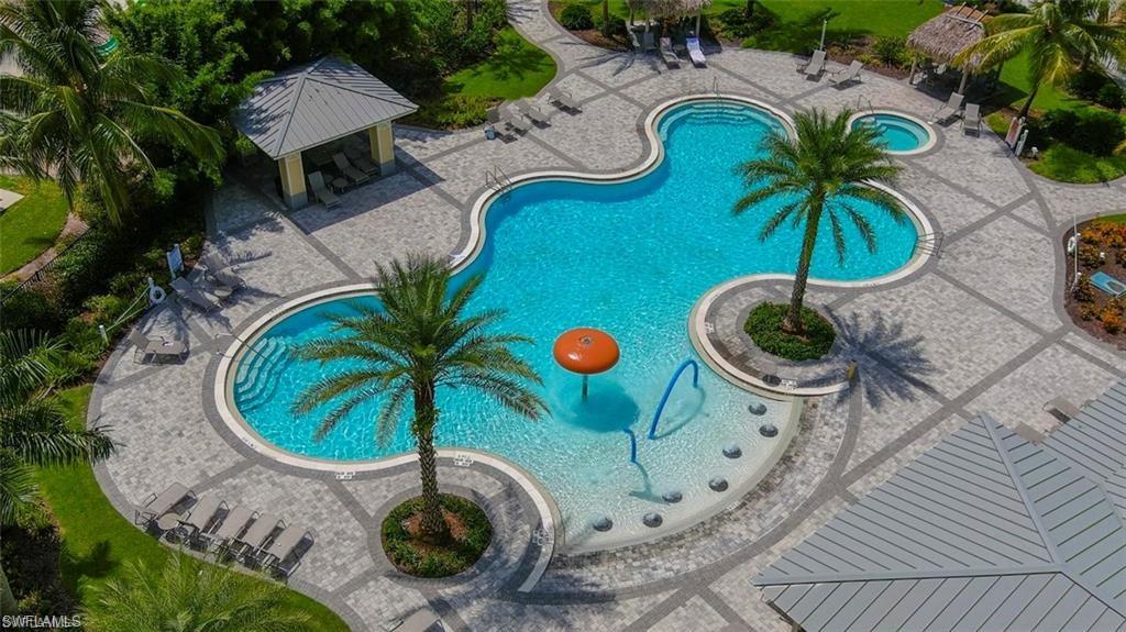 Undisclosed Address Naples, FL 34120 - Photo 21 of 21 an aerial view of garden space with swimming pool and outdoor seating