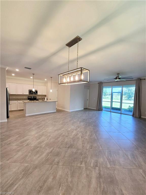 Undisclosed Address Naples, FL 34120 - Photo 6 of 21 a view of a kitchen with a sink and a stove top oven