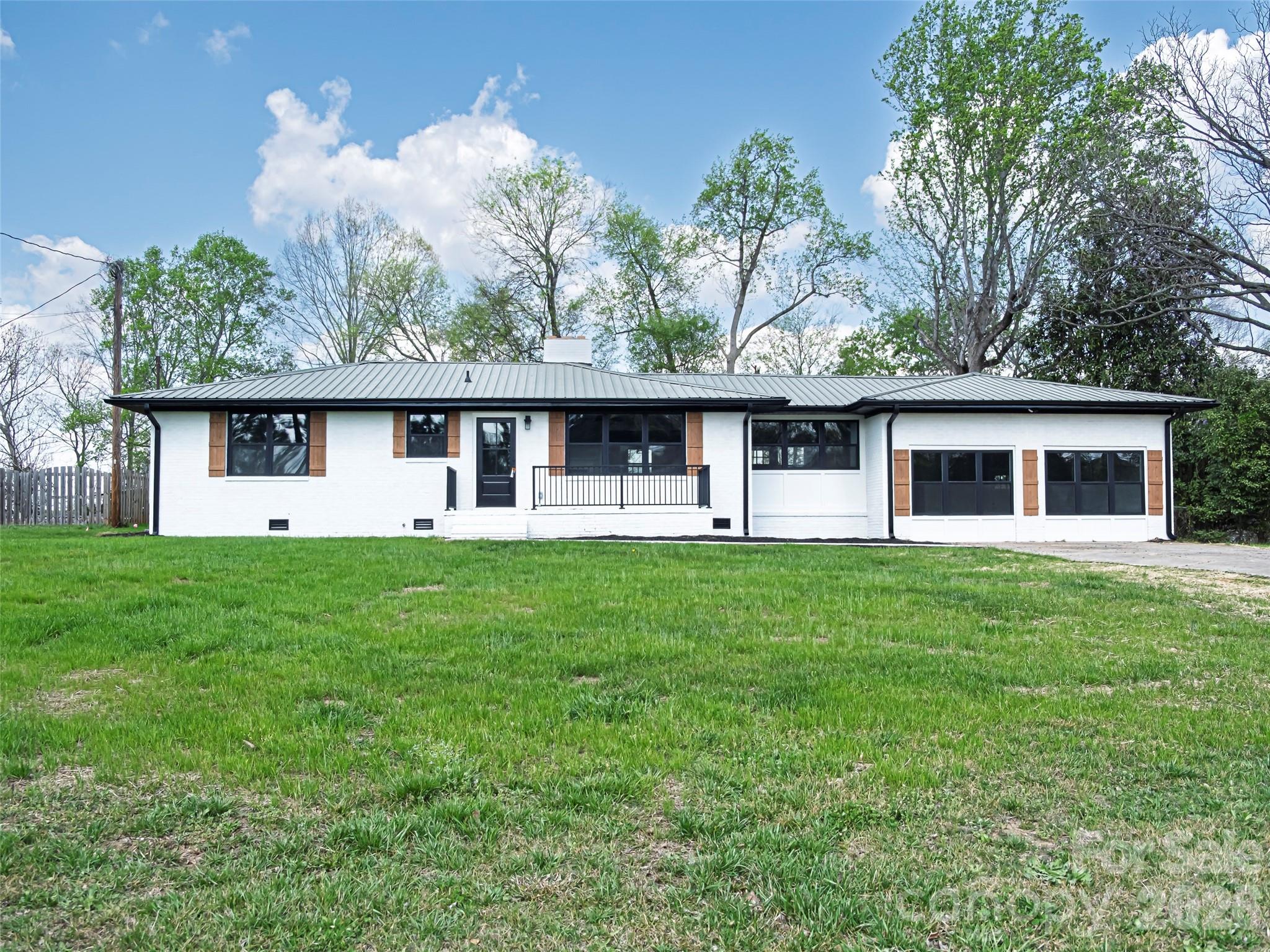 1325 Armstrong Road Belmont, NC 28012 - Photo 1 of 33 front view of a house with a yard
