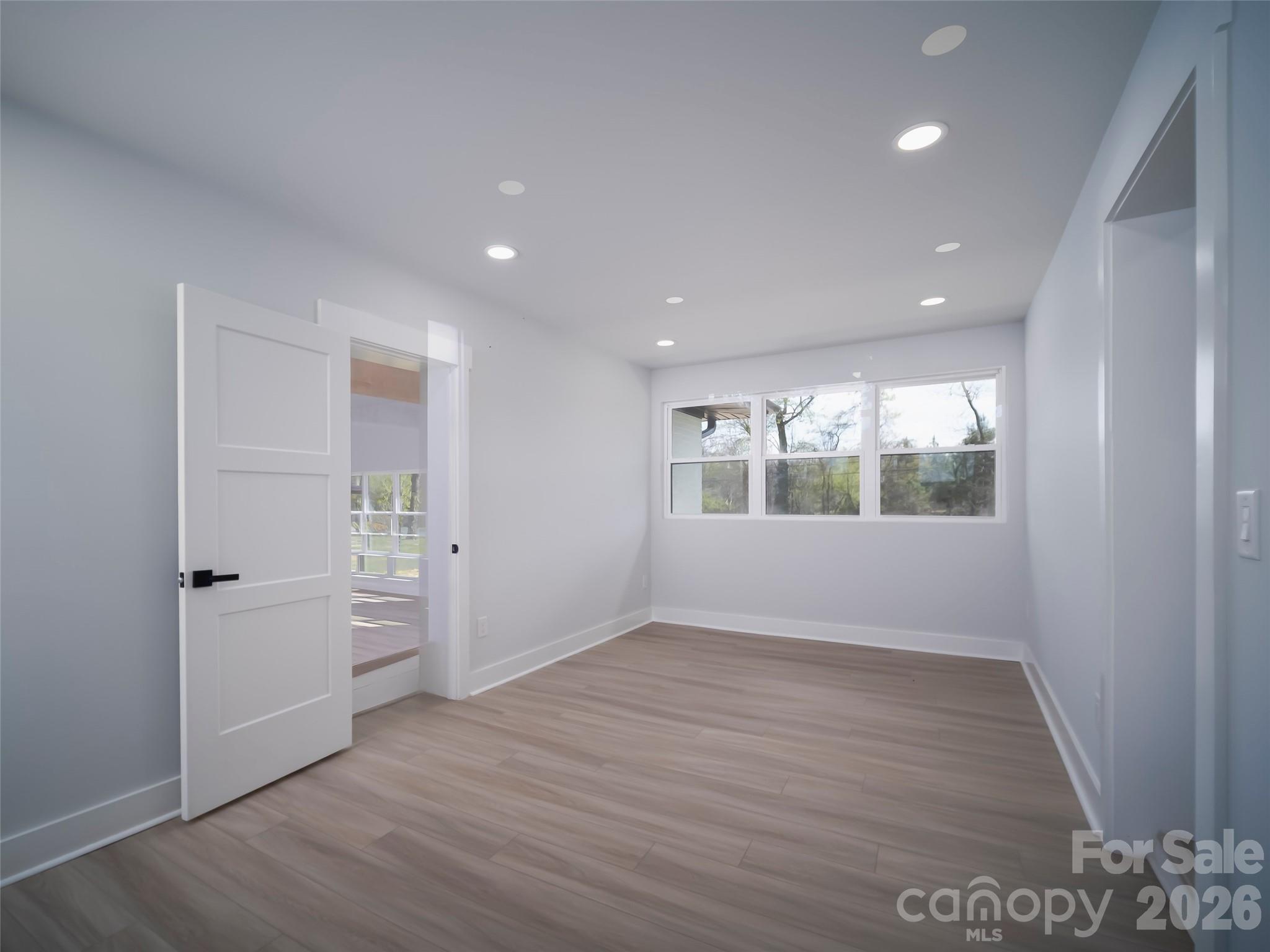 1325 Armstrong Road Belmont, NC 28012 - Photo 11 of 33 wooden floor in an empty room with a window