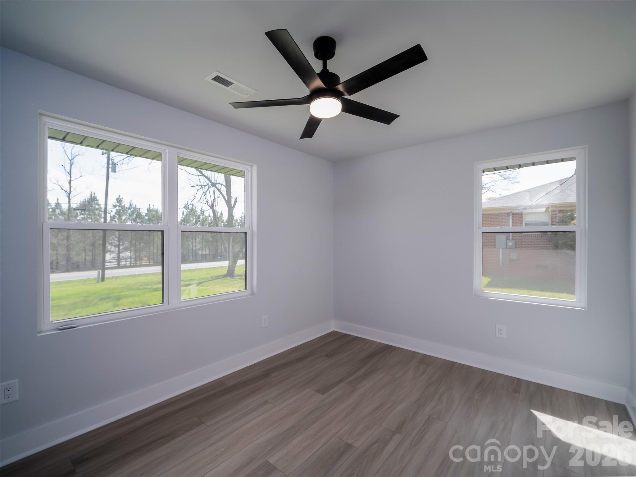1325 Armstrong Road Belmont, NC 28012 - Photo 16 of 33 a view of an empty room with wooden floor and a window