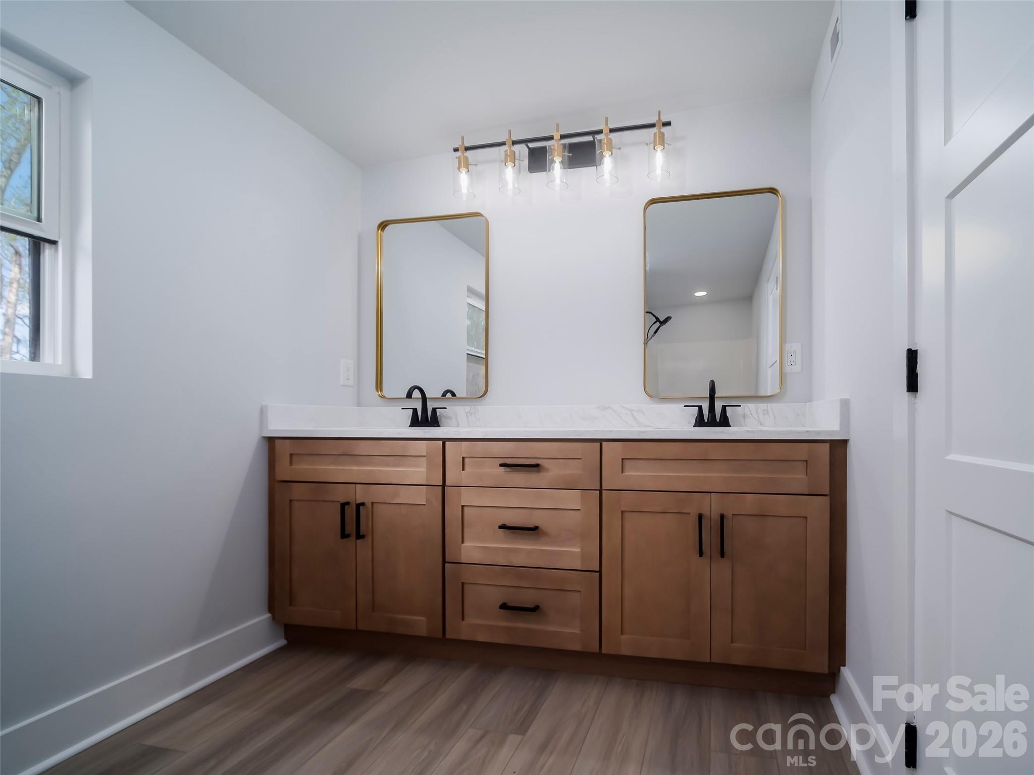 1325 Armstrong Road Belmont, NC 28012 - Photo 20 of 33 a bathroom with a double vanity sink and mirror
