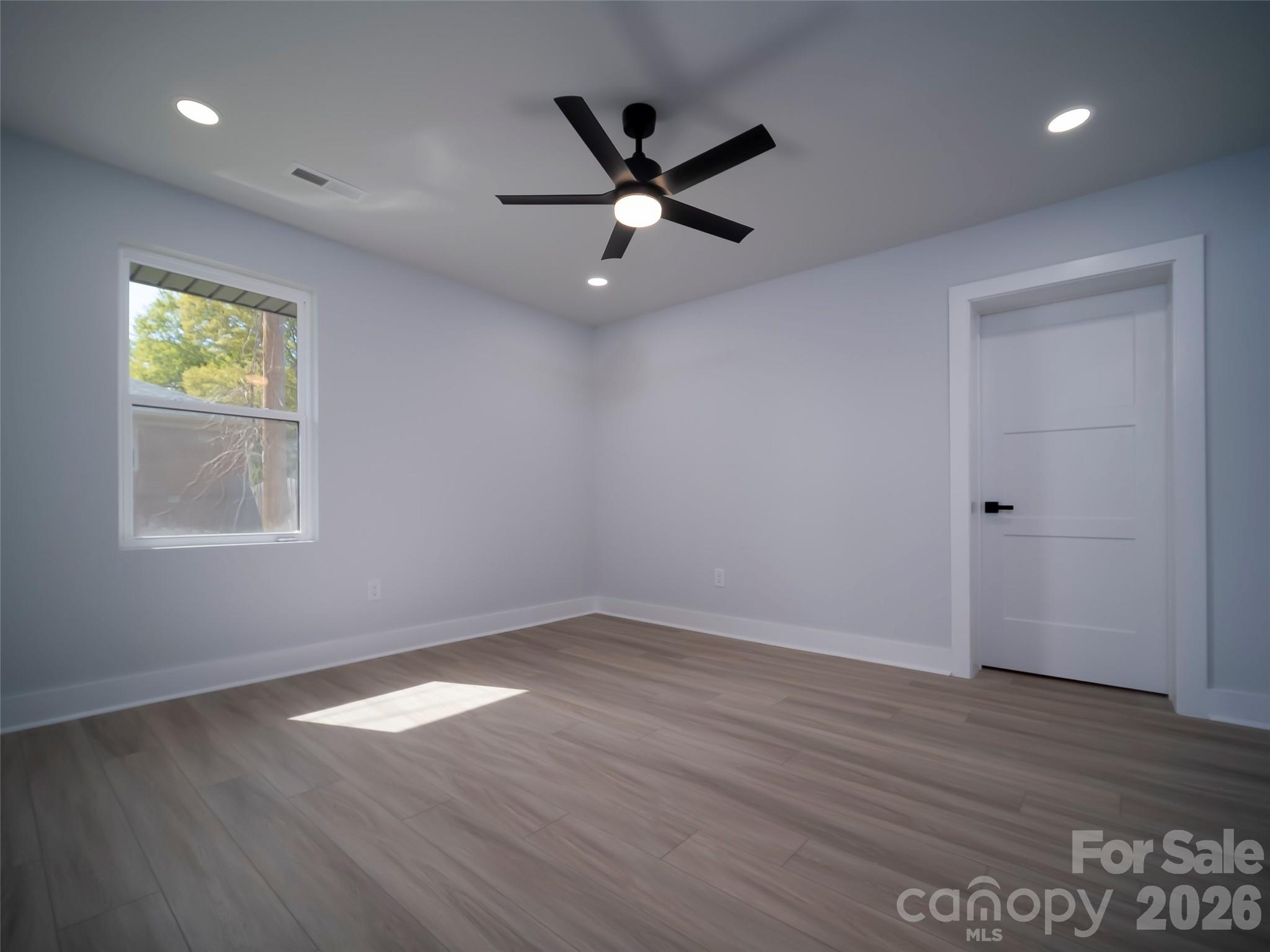 1325 Armstrong Road Belmont, NC 28012 - Photo 23 of 33 wooden floor in an empty room with a window
