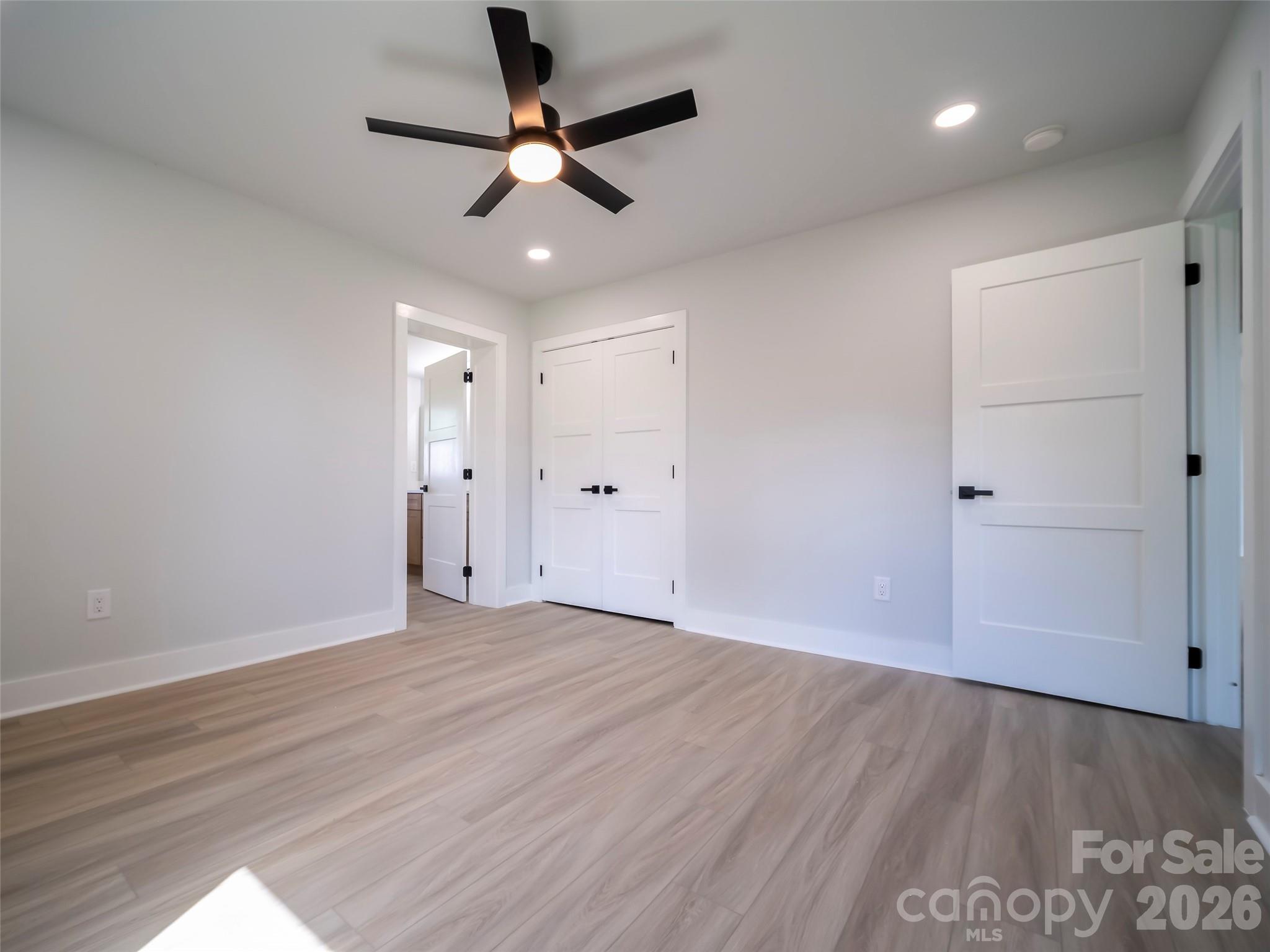 1325 Armstrong Road Belmont, NC 28012 - Photo 24 of 33 an empty room with wooden floor and windows