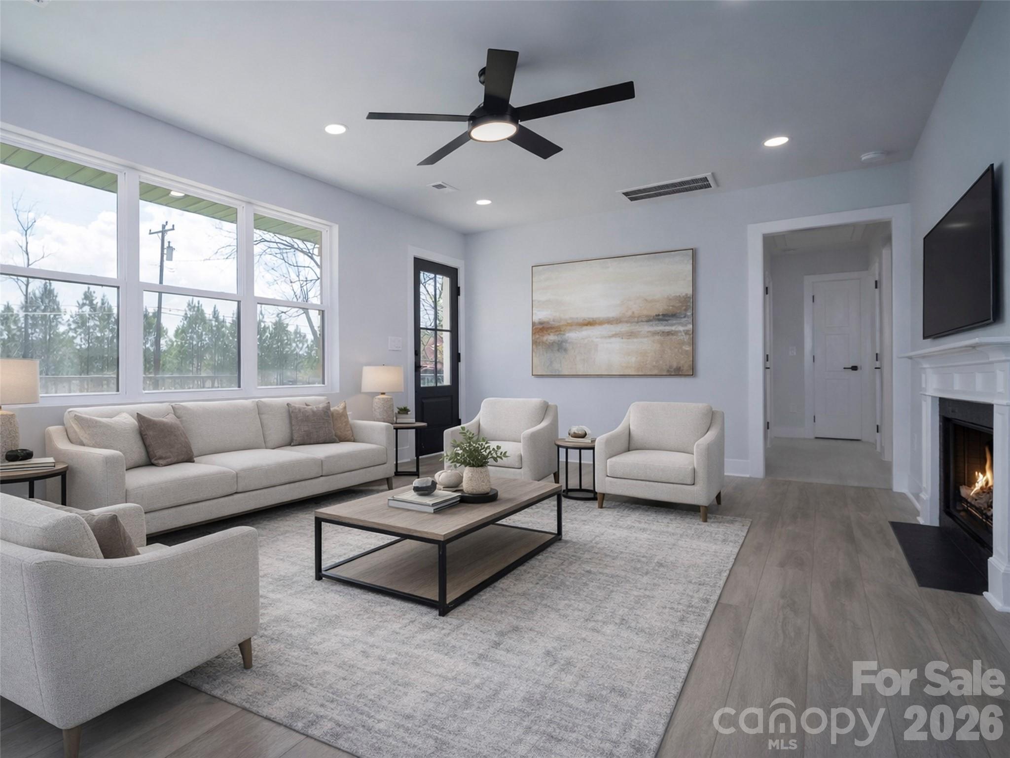 1325 Armstrong Road Belmont, NC 28012 - Photo 3 of 33 a living room with furniture fireplace and a flat screen tv