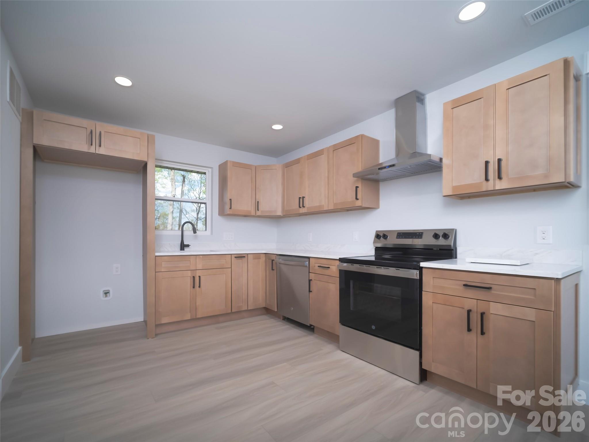 1325 Armstrong Road Belmont, NC 28012 - Photo 6 of 33 a kitchen with stainless steel appliances granite countertop a sink and cabinets