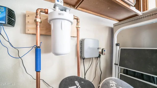a living room with furniture a fireplace and a floor to ceiling window