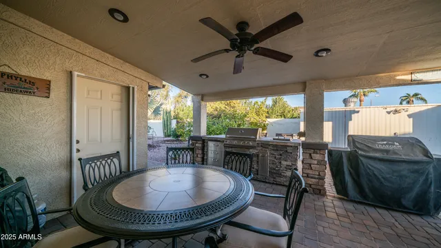 a view of a house with chairs and a table
