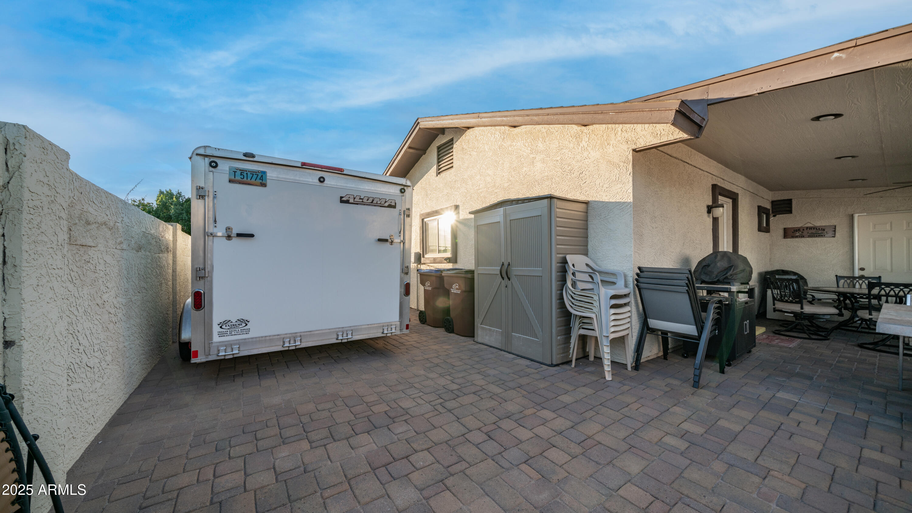 657 South Copper Drive Apache Junction, AZ 85120 - Photo 34 of 44 a view of a house with chairs and a table