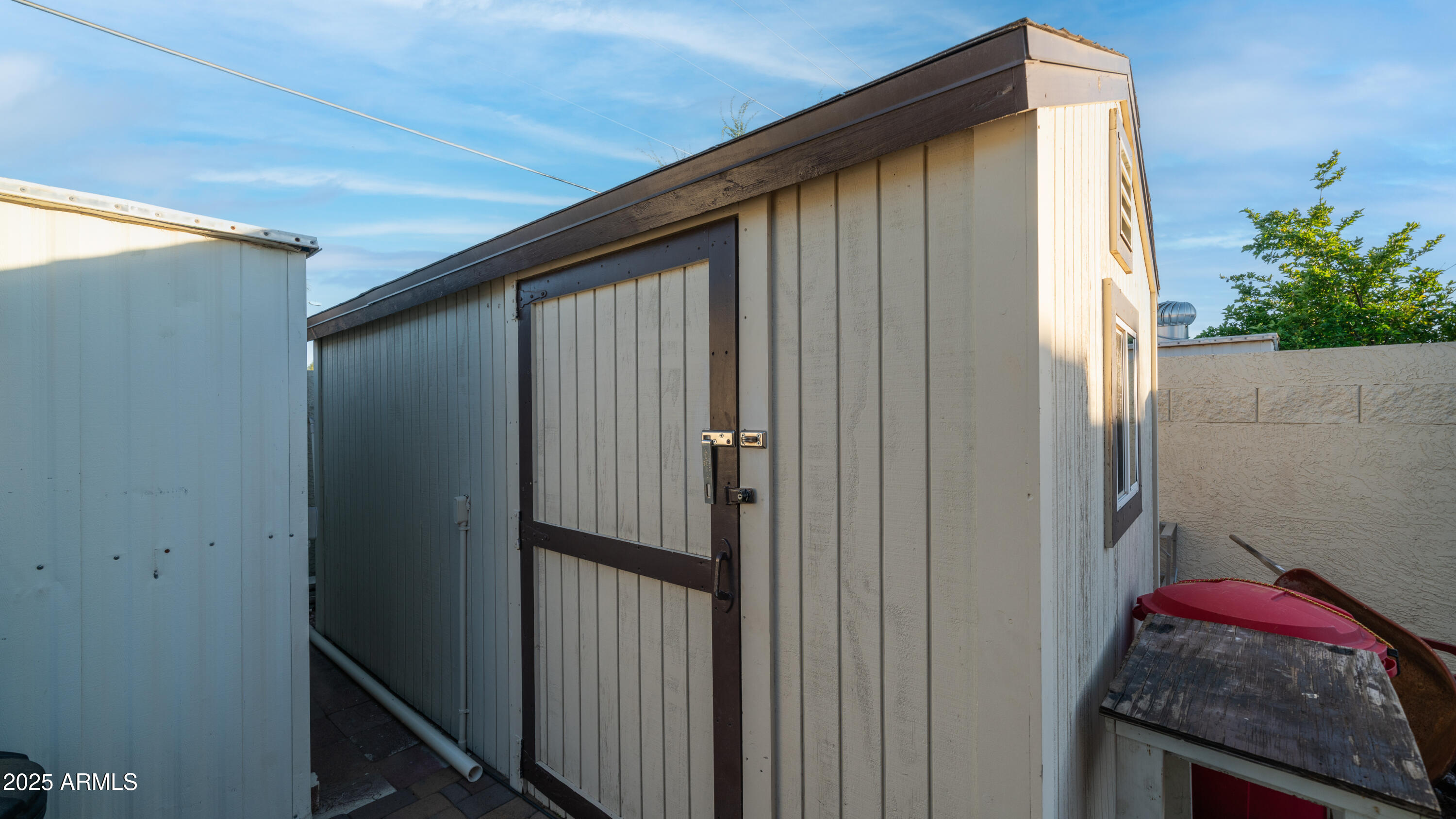 657 South Copper Drive Apache Junction, AZ 85120 - Photo 36 of 44 a view of a house with a small cabin