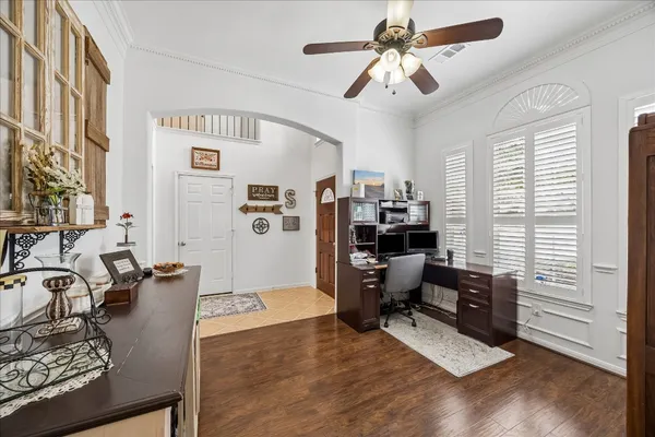 a workspace with furniture and a window