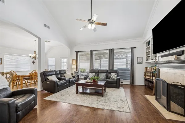 a living room with furniture fireplace and flat screen tv