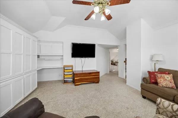 a bedroom with furniture and a chandelier