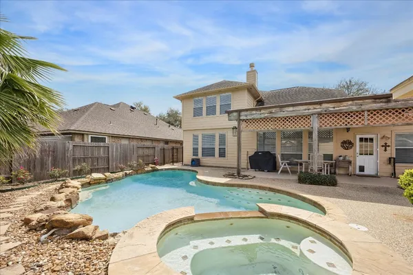 a front view of house with yard outdoor seating and barbeque oven