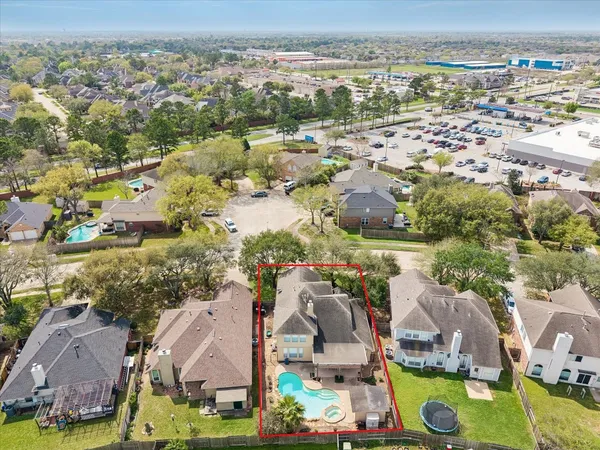 an aerial view of residential houses with outdoor space