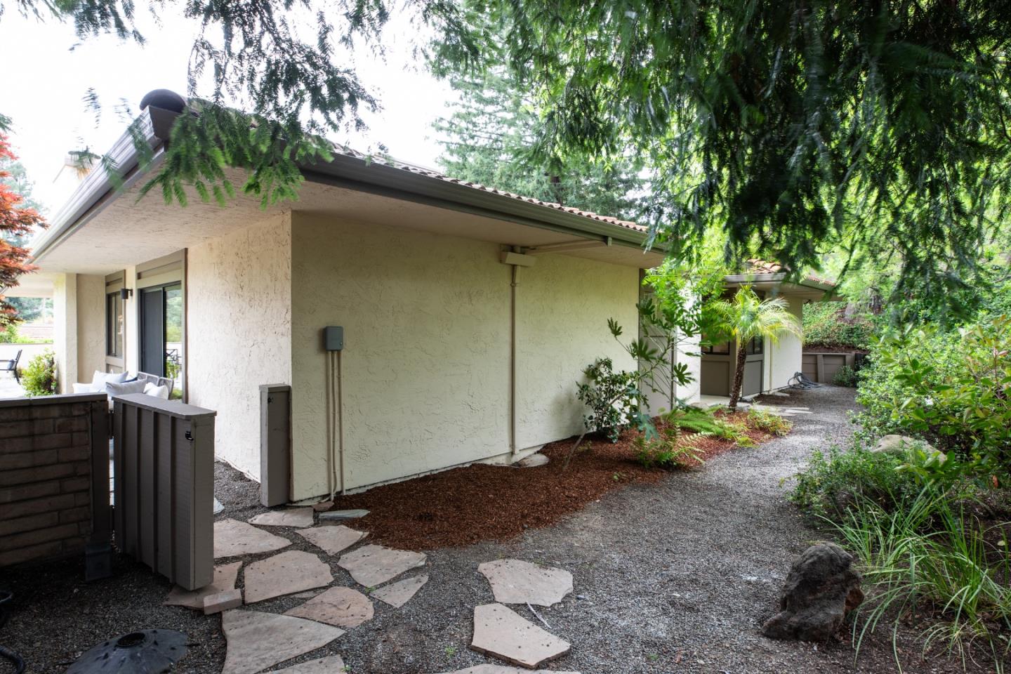 22415 Rancho Deep Cliff Drive Cupertino, CA 95014 - Photo 27 of 33 a backyard of a house with potted plants and trees