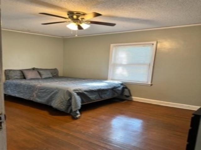 1010 Mt Vernon Road Memphis, TN 38111 - Photo 7 of 11 a bedroom with a bed and a chandelier