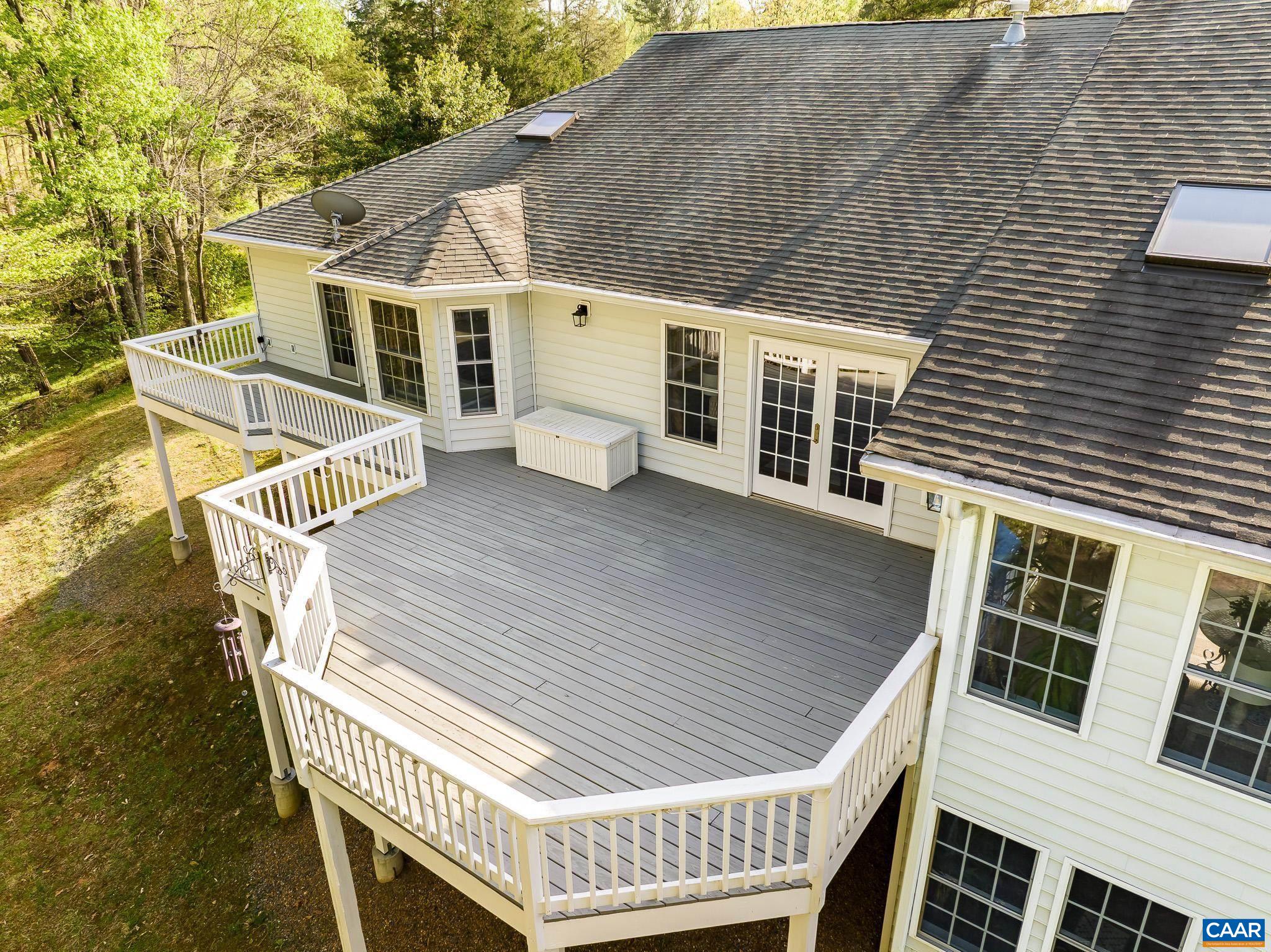 1089 Broken Island Road Palmyra, VA 22963 - Photo 12 of 74 a view of a house with a deck and furniture