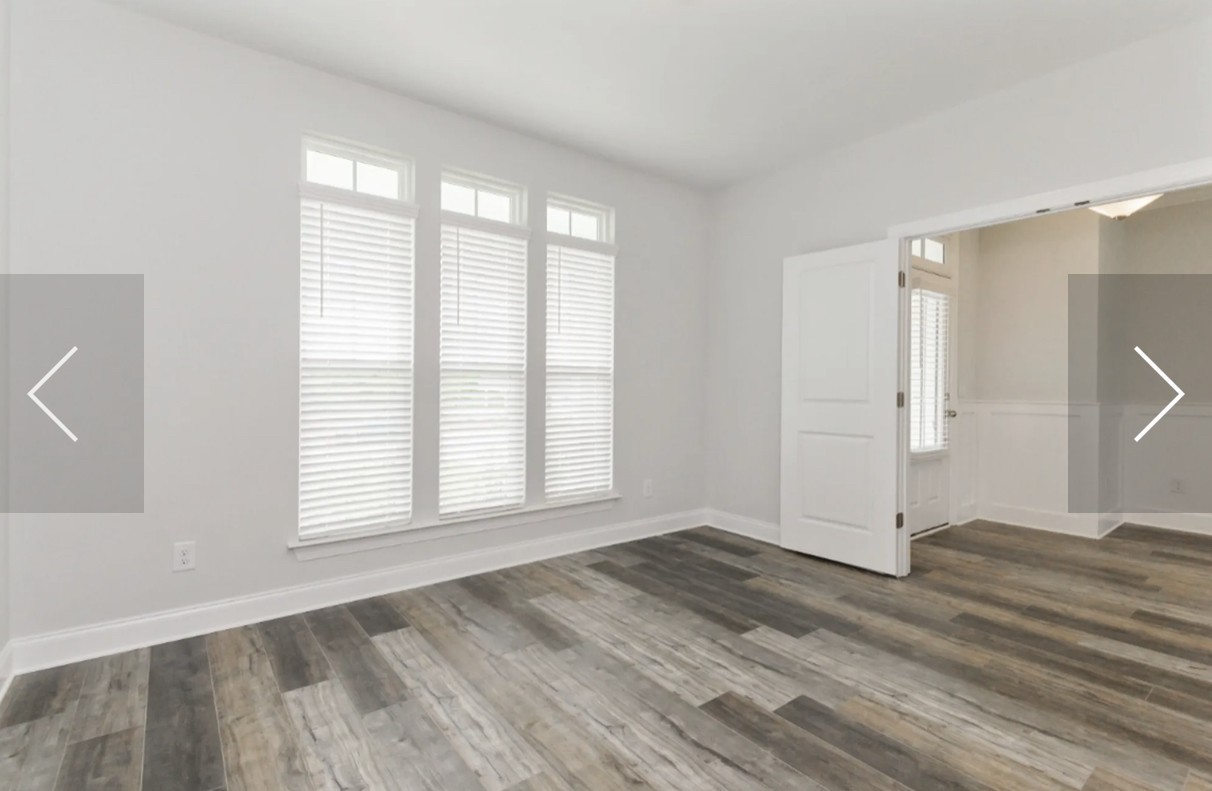 7132 Pepper Tree Circle Fairview, TN 37062 - Photo 7 of 14 an empty room with wooden floor and windows