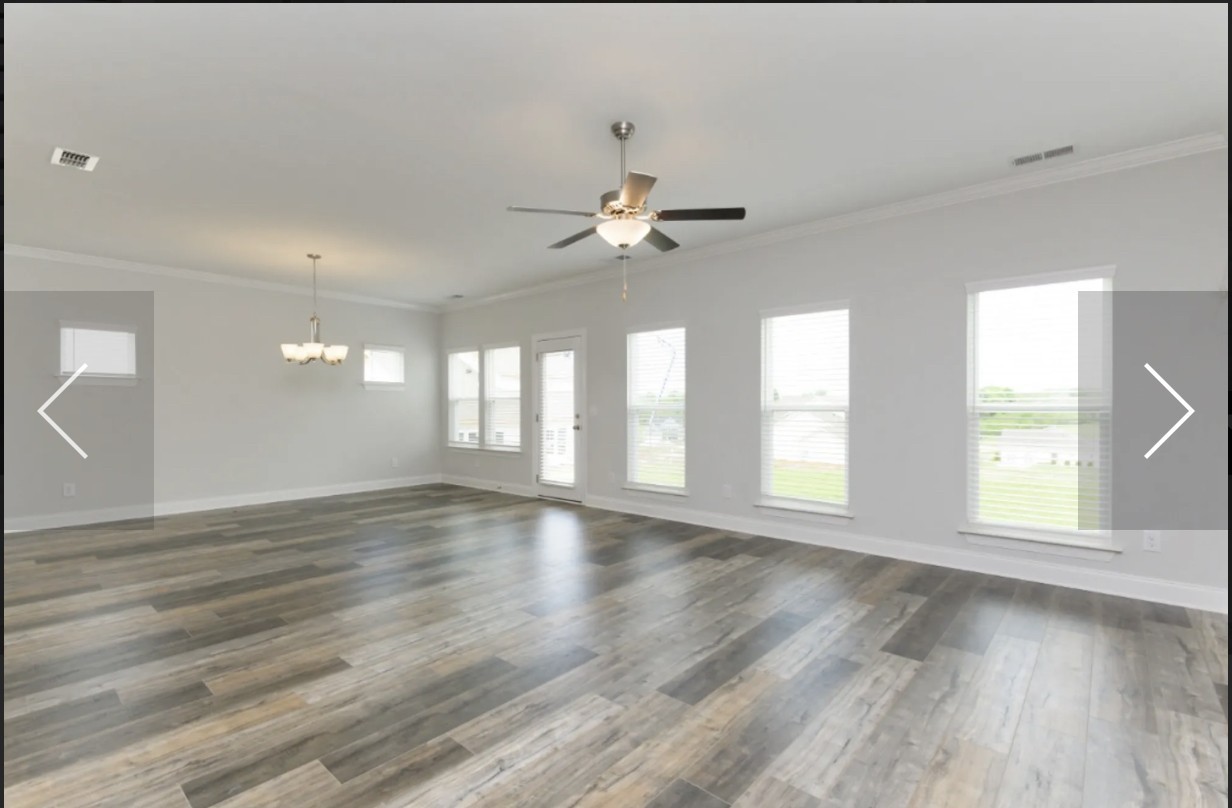 7132 Pepper Tree Circle Fairview, TN 37062 - Photo 8 of 14 an empty room with wooden floor and windows