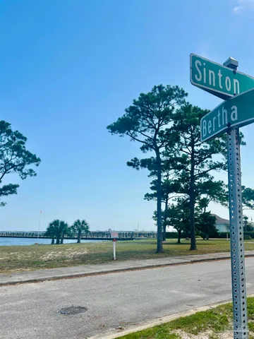 a street sign on a pole on a road