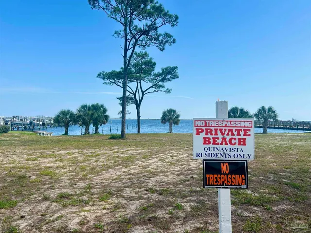 a sign on a pole on a wall