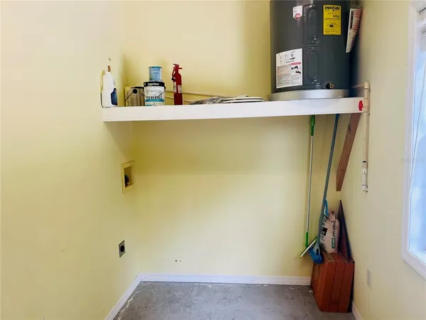 a room with a sink and cabinets