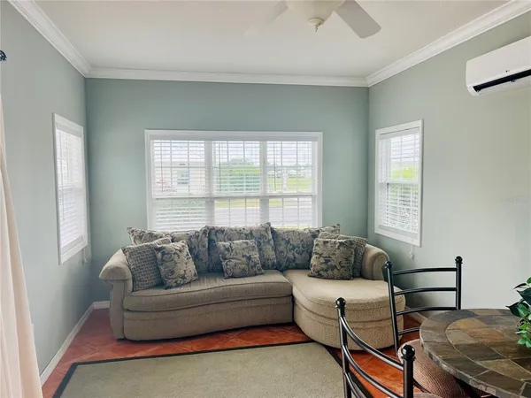 a living room with furniture and a window