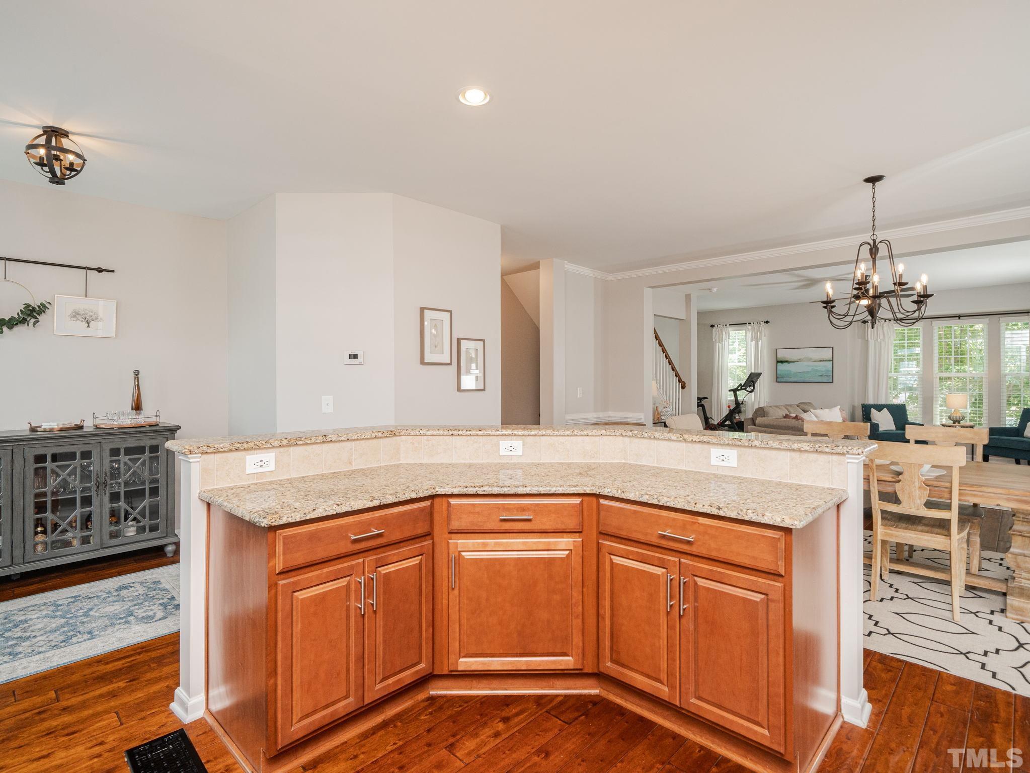 1307 Rodessa Run Raleigh, NC 27607 - Photo 18 of 36 a kitchen with stainless steel appliances granite countertop a sink and cabinets