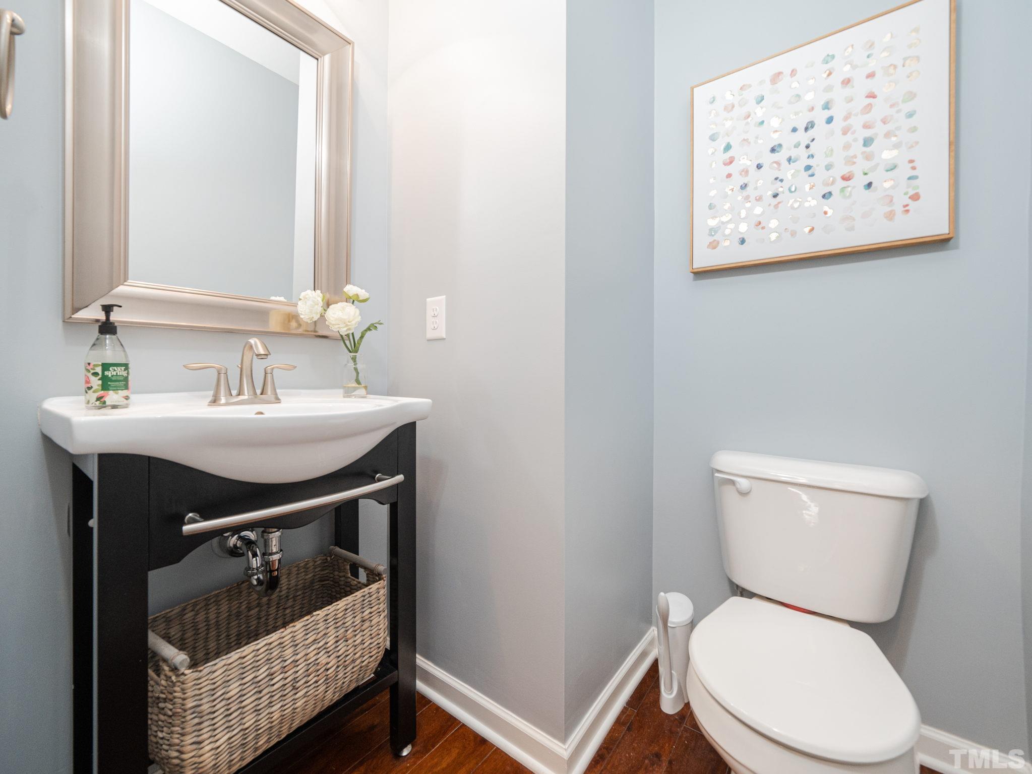 1307 Rodessa Run Raleigh, NC 27607 - Photo 20 of 36 a bathroom with a sink toilet and a mirror
