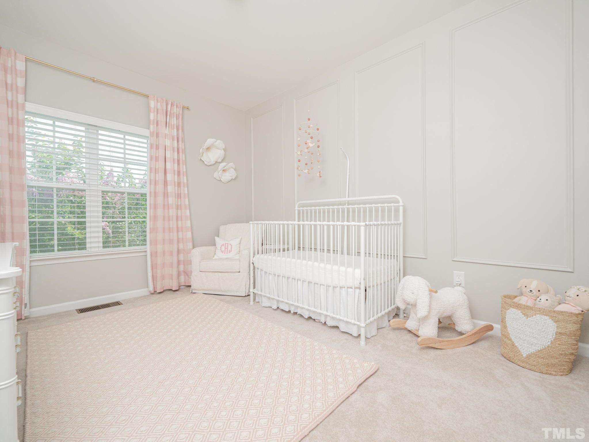 1307 Rodessa Run Raleigh, NC 27607 - Photo 26 of 36 a bedroom with a bed and a window