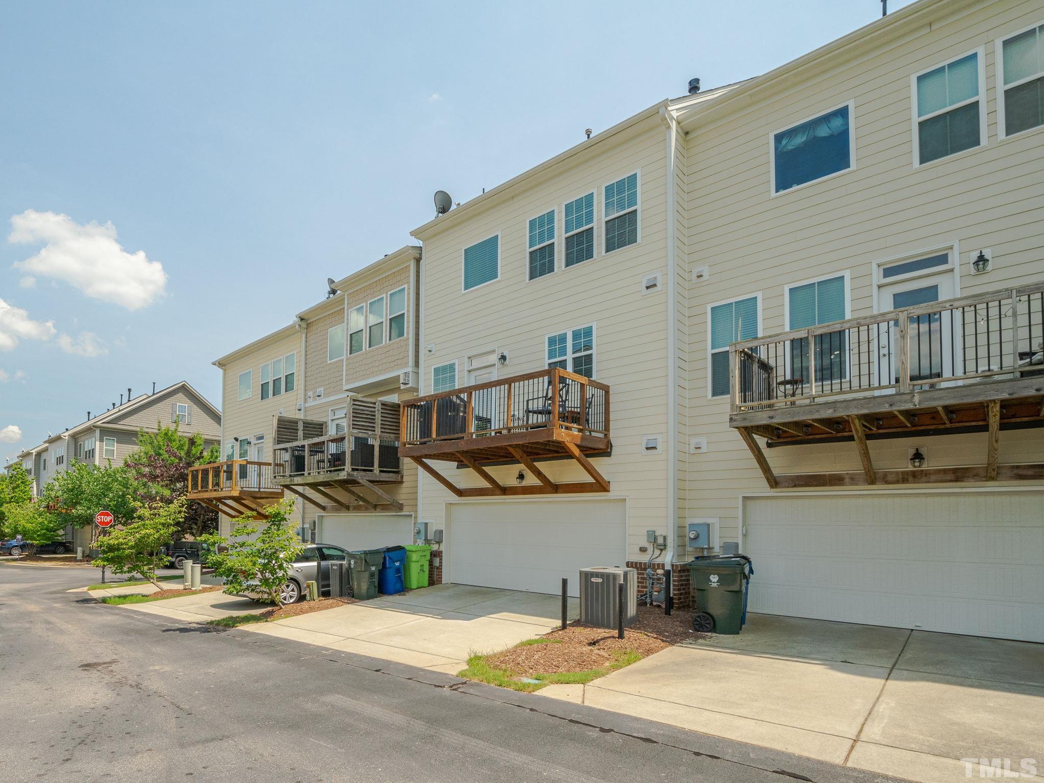 1307 Rodessa Run Raleigh, NC 27607 - Photo 32 of 36 a front view of a building with outdoor space and parking