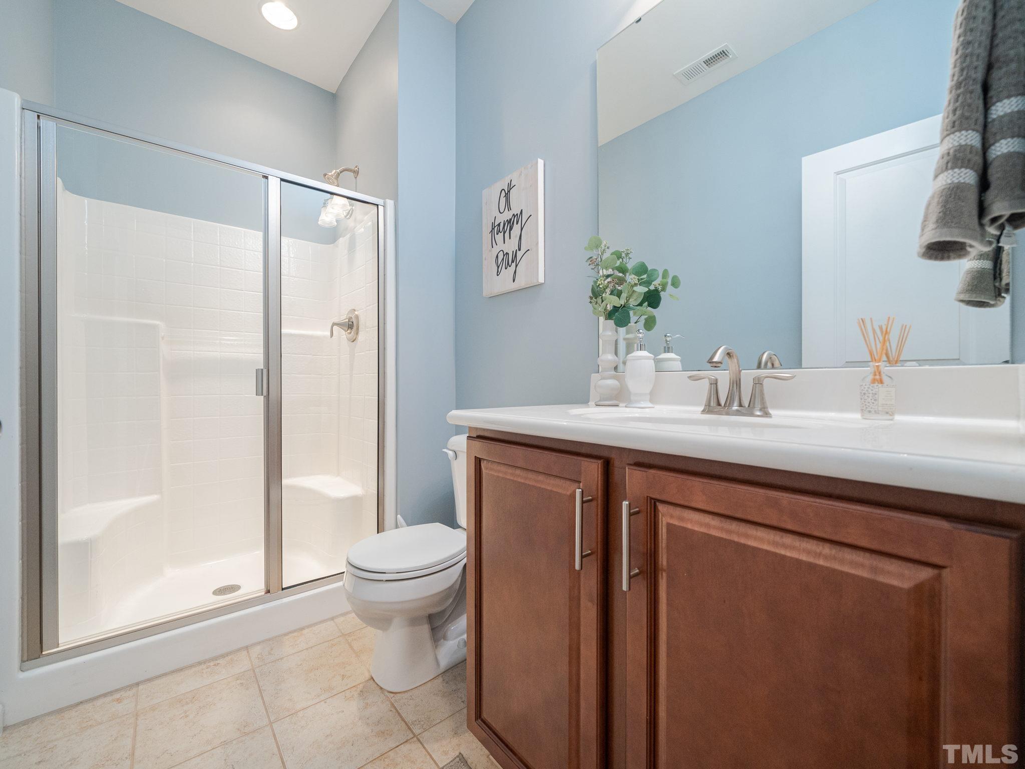 1307 Rodessa Run Raleigh, NC 27607 - Photo 7 of 36 a bathroom with a sink a toilet and shower