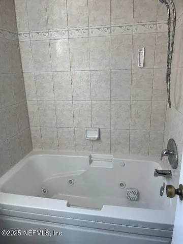 a bathroom with a bathtub