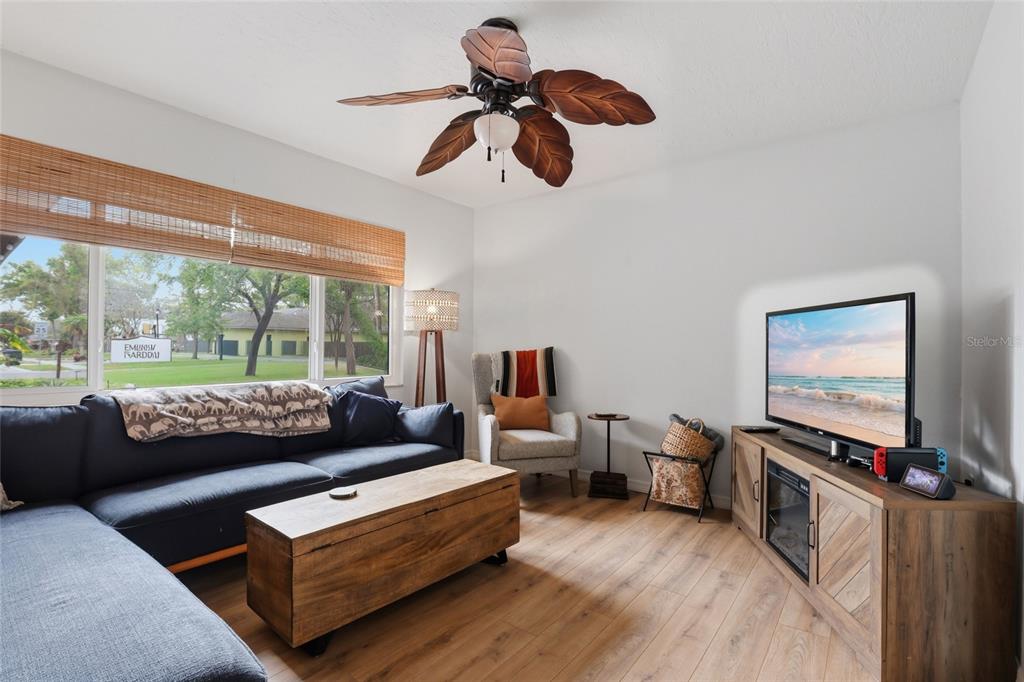 4576 Bliss Road Sarasota, FL 34233 - Photo 7 of 40 a living room with furniture and a flat screen tv