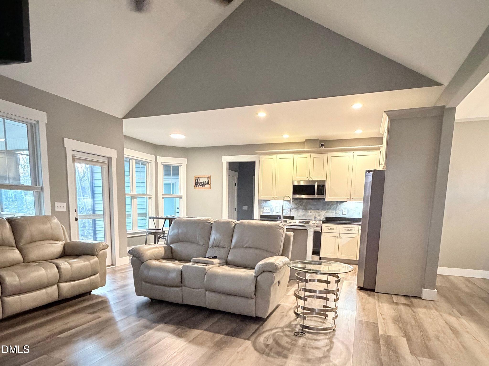 55 Running Deer Path Timberlake, NC 27583 - Photo 11 of 29 a living room with furniture and a large window