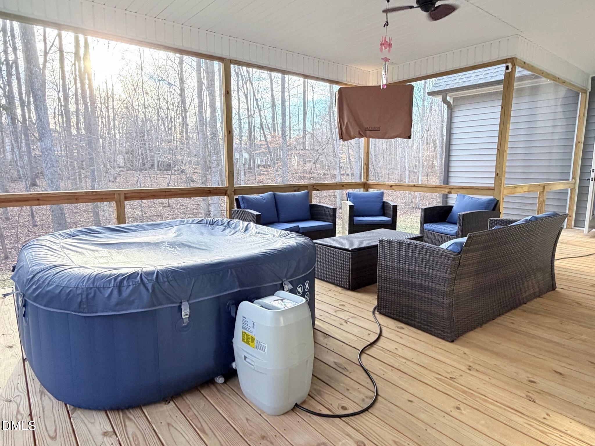 55 Running Deer Path Timberlake, NC 27583 - Photo 27 of 29 a living room with couches and a chandelier